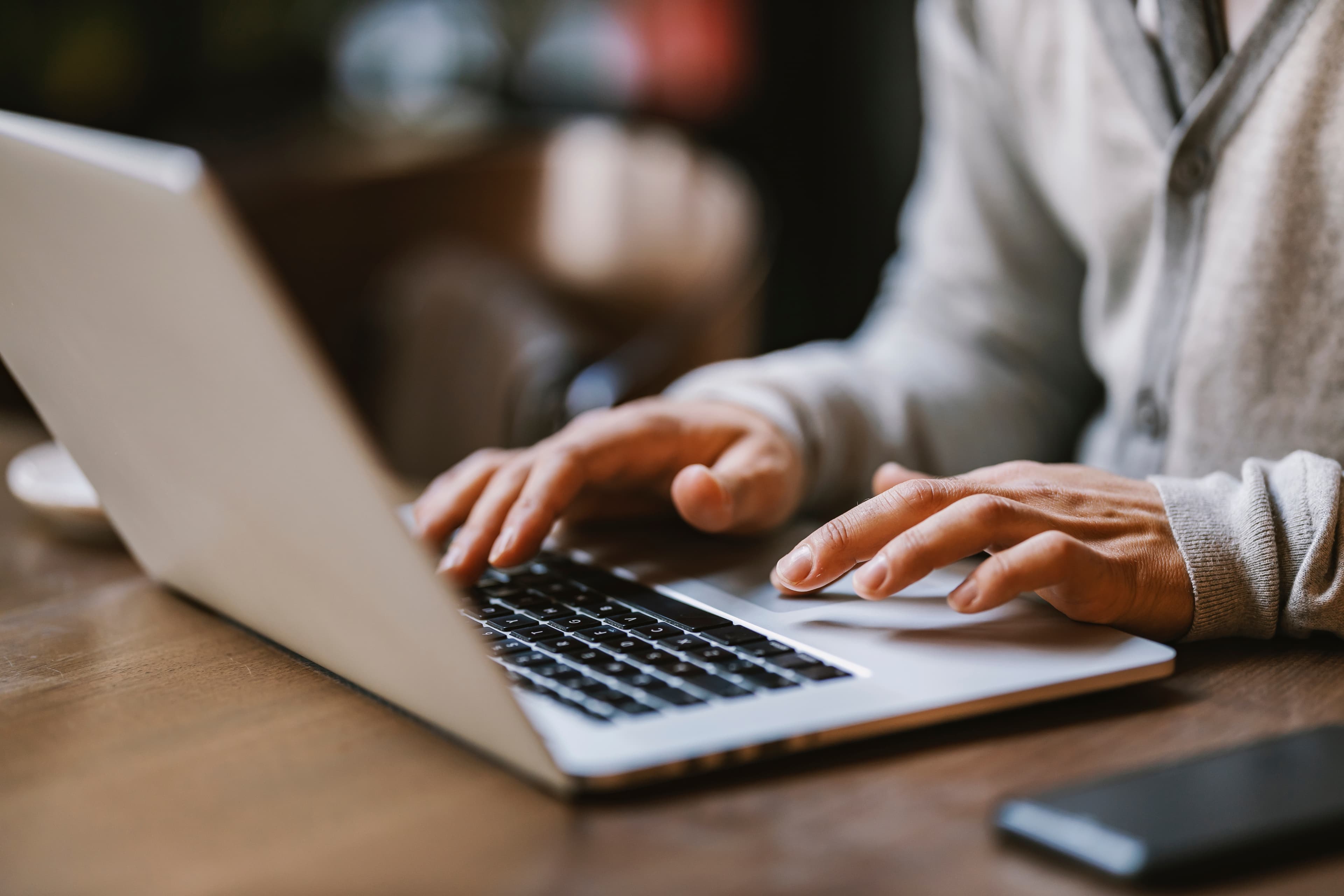 a person using a macbook on a table