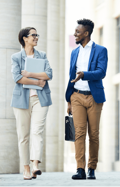 DMA Grid 1 two people walking and talking about business