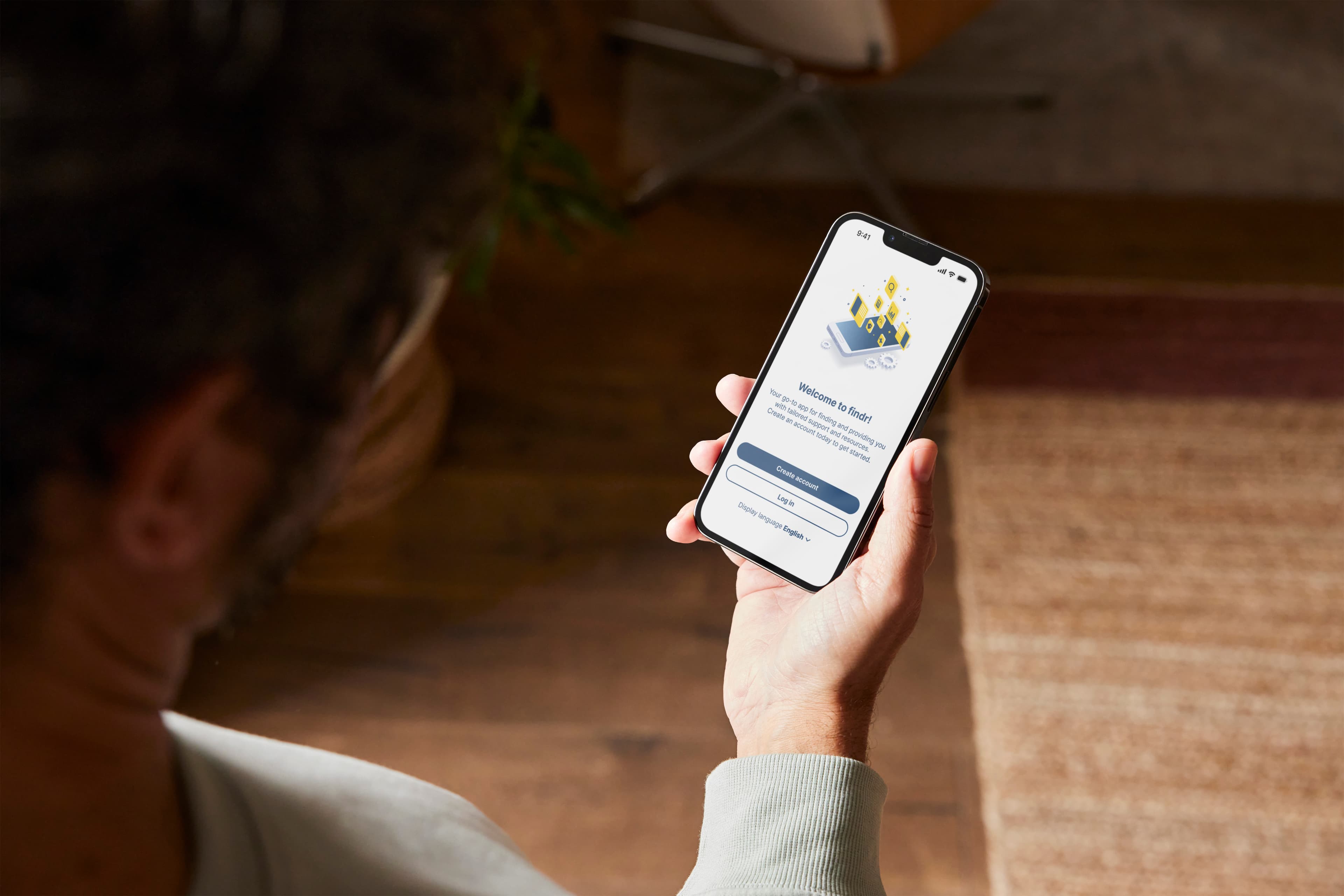 A woman using the Findr App on an iPhone