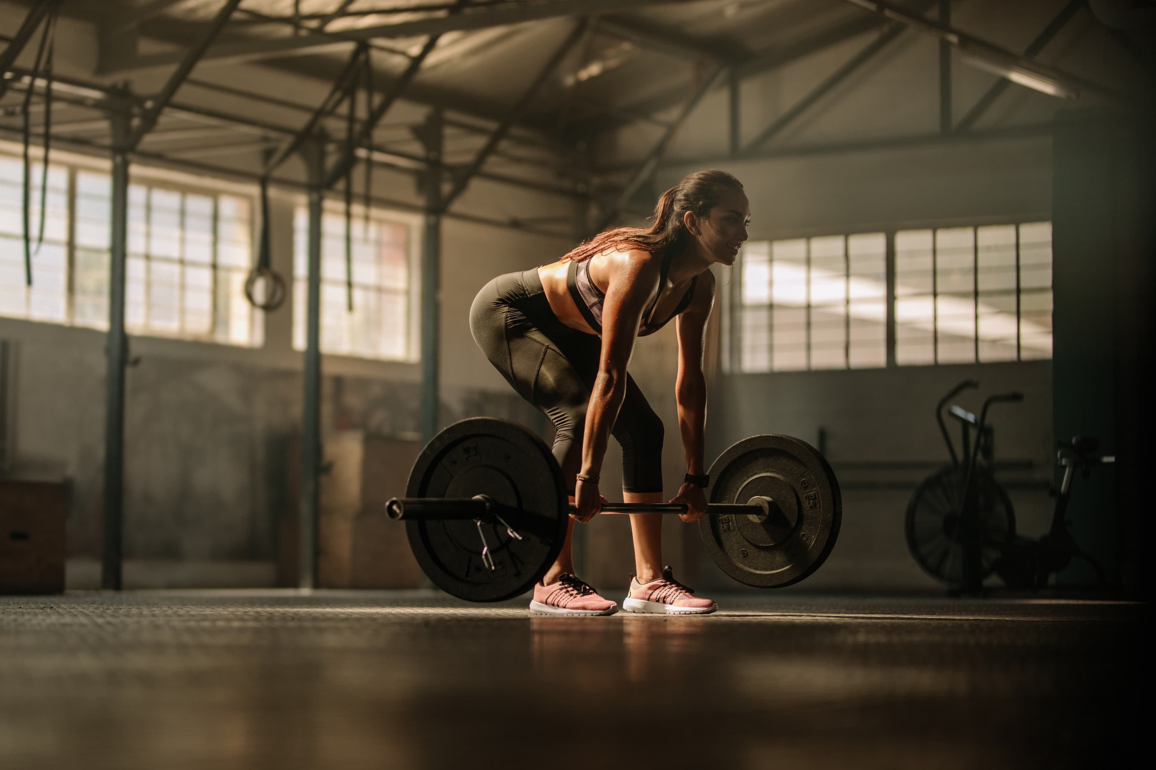 Person lifting weights in a gym