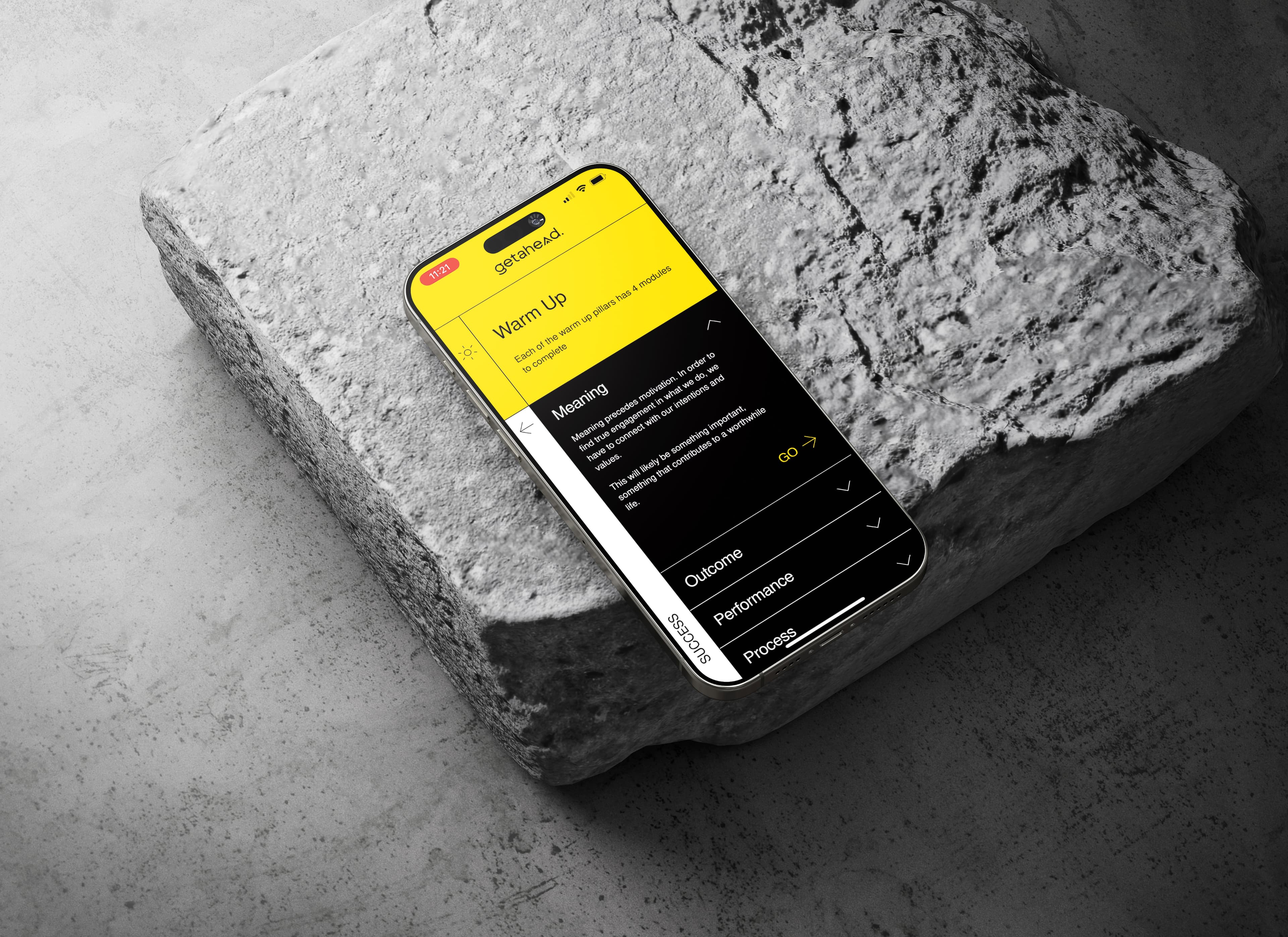Getahead app on iphone on grey stone