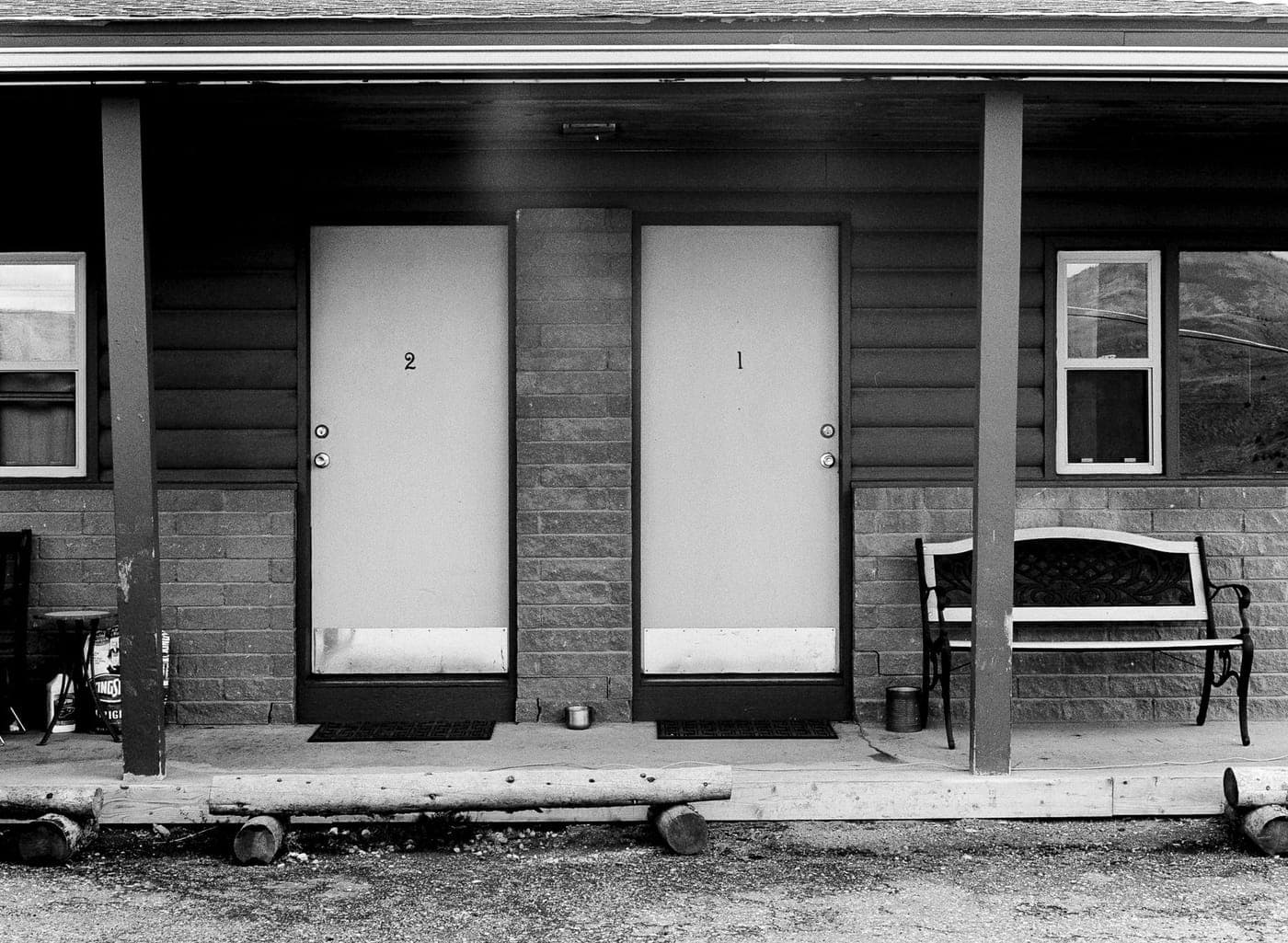 Two identical white doors numbered 1 and 2, like the choice in Flutter vs React Native