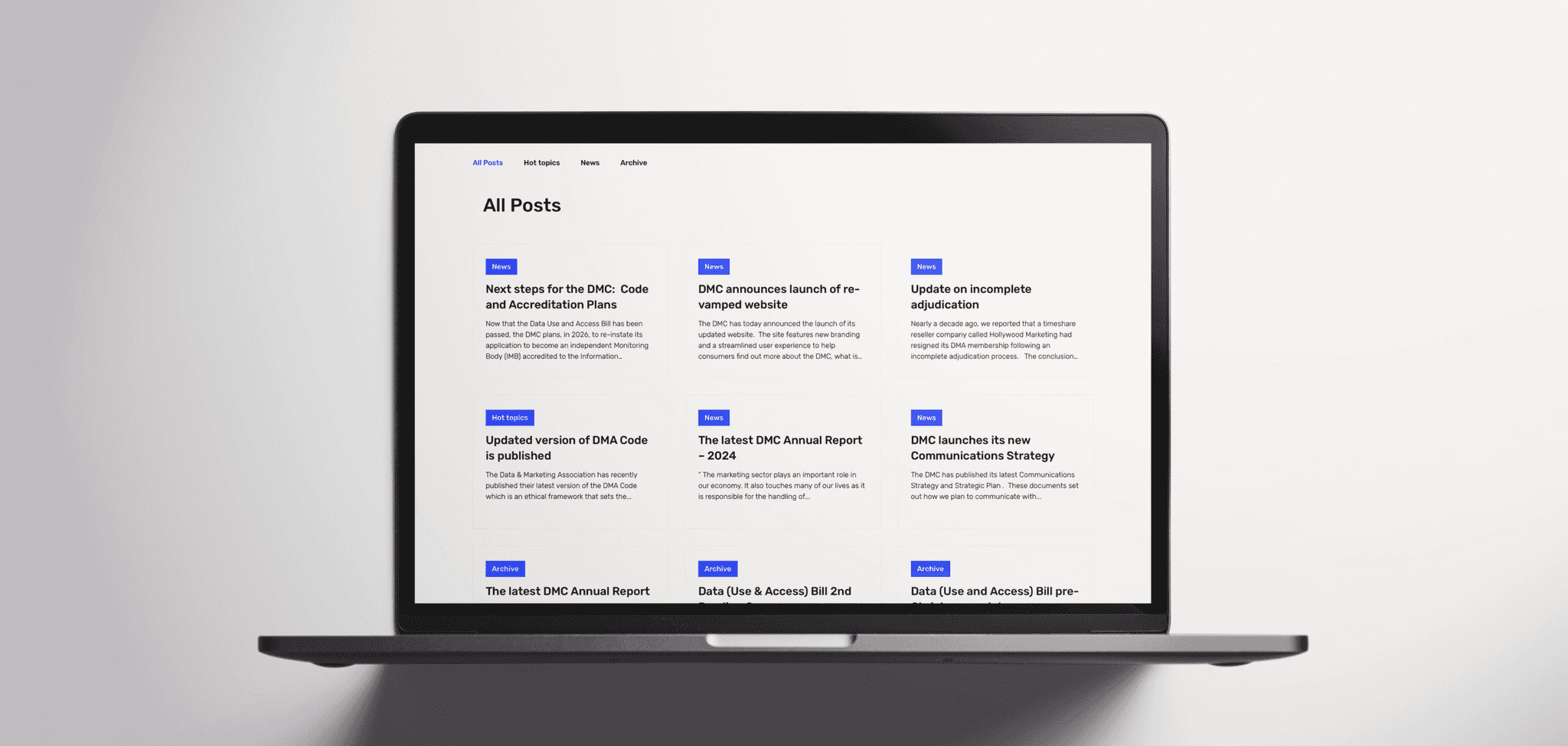 DM Commission website on a macbook and white background